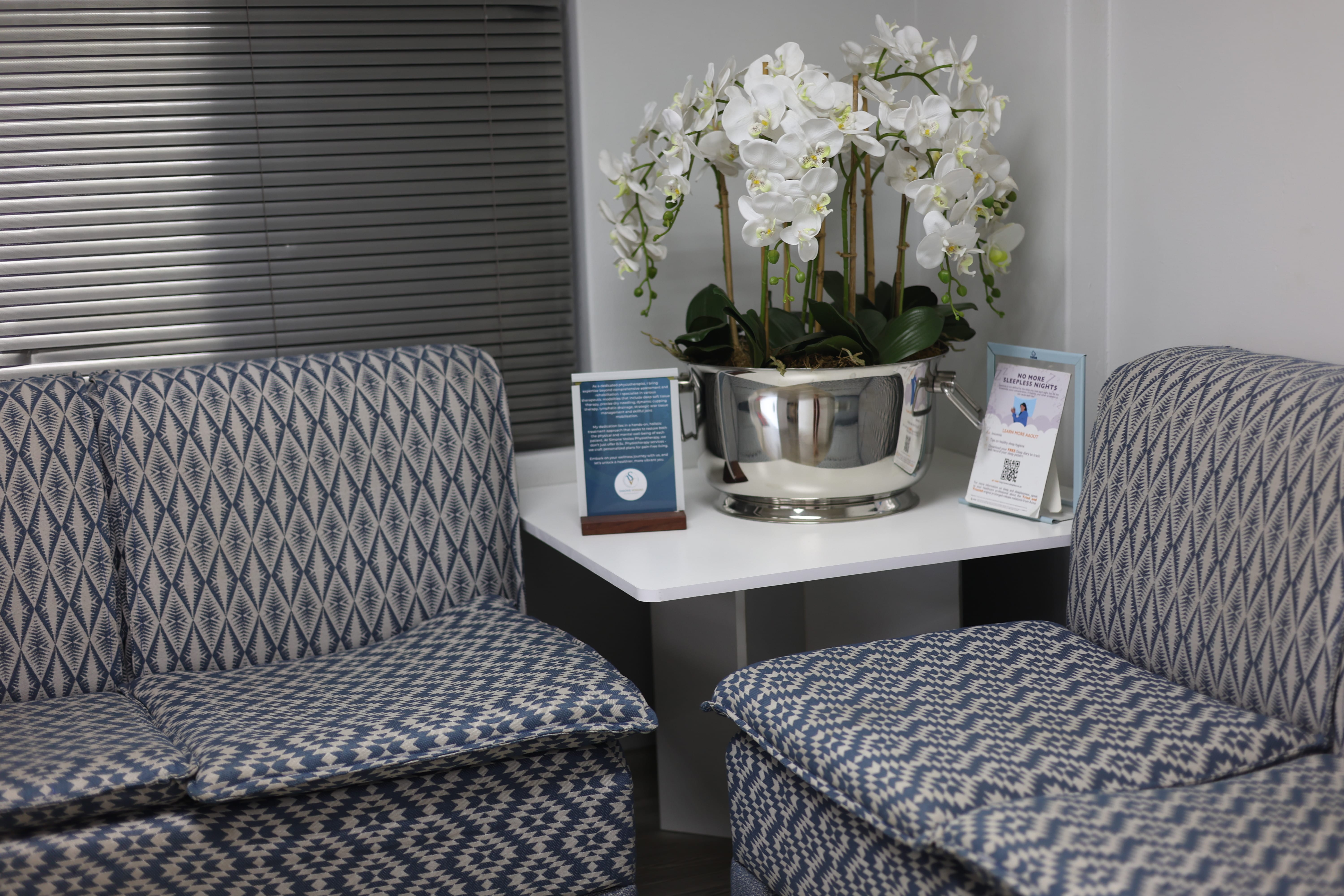 Waiting area at Sunningdale Medical Centre with orchids