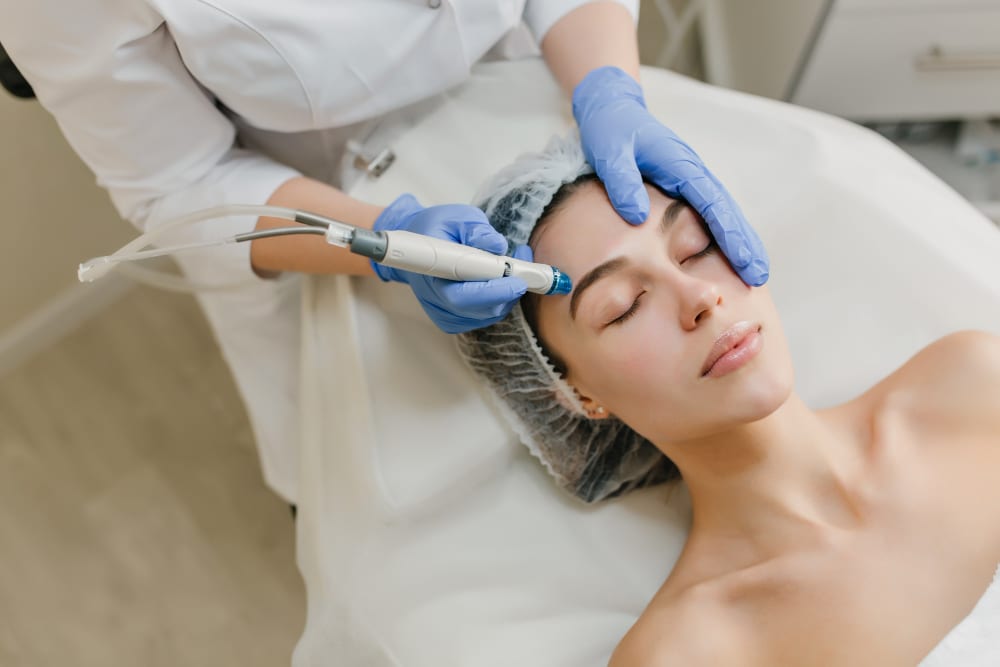 A patient receiving a facial skin treatment